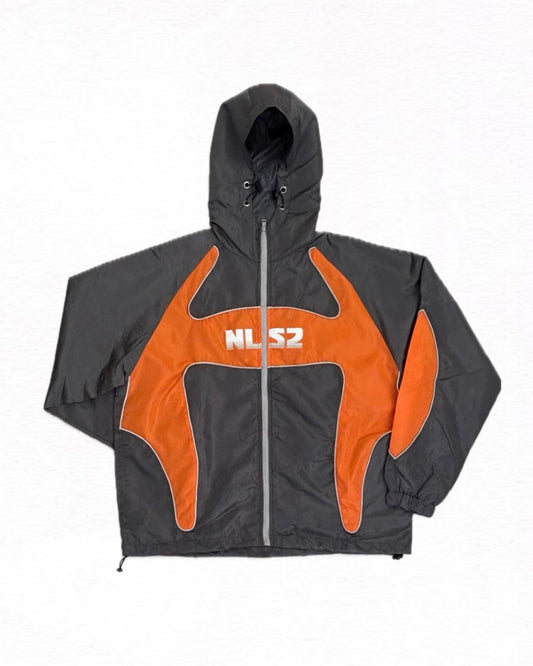 A hooded windbreaker jacket in dark gray and bright orange, featuring a white 'NLS2' logo printed on the chest, 