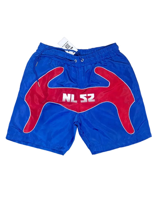 Blue athletic shorts with a large red abstract graphic on the front with a white 'NLS2 Logo